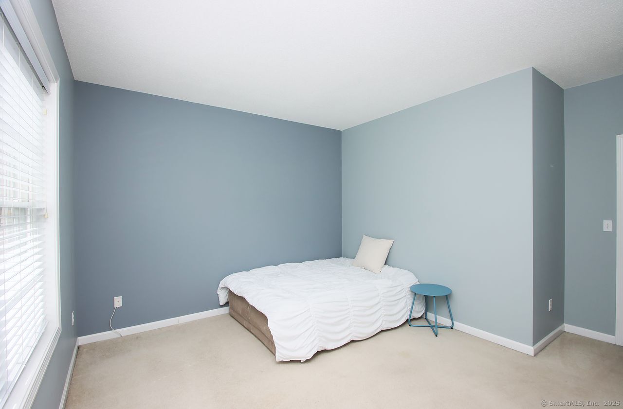 35 Todd Street, Unit 103 Hamden, CT 06518 - Photo 30 of 40 a room with a bed and a window