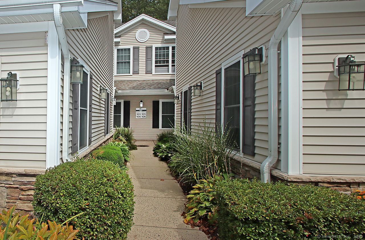 35 Todd Street, Unit 103 Hamden, CT 06518 - Photo 3 of 40 a front view of a house with a yard