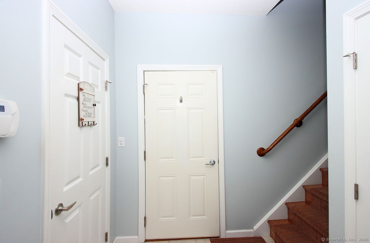 35 Todd Street, Unit 103 Hamden, CT 06518 - Photo 6 of 40 a view of a hallway with staircase