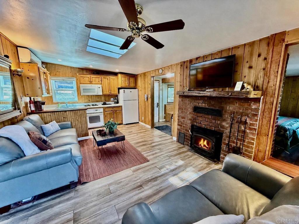 22292 Crestline Road Palomar Mountain, CA 92060 - Photo 3 of 38 a living room with furniture fireplace and flat screen tv