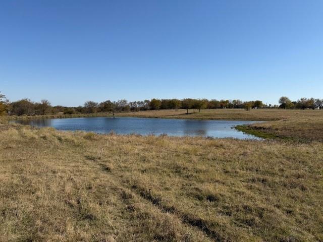 124.75-ac Donald Road Krum, TX 76249 - Photo 3 of 13 a view of a lake with houses in the back