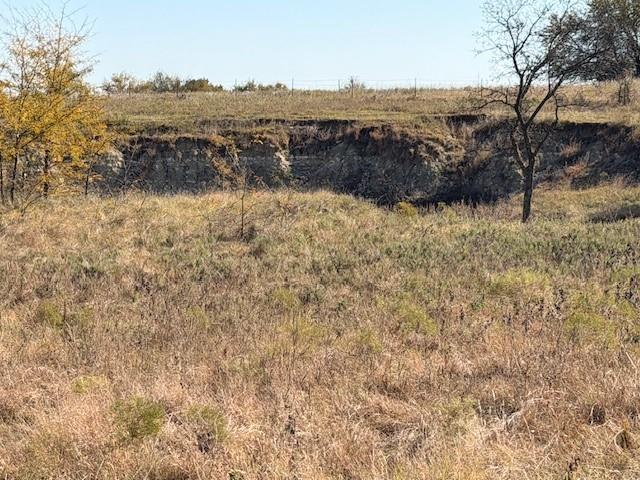 124.75-ac Donald Road Krum, TX 76249 - Photo 9 of 13 a view of lake with mountain