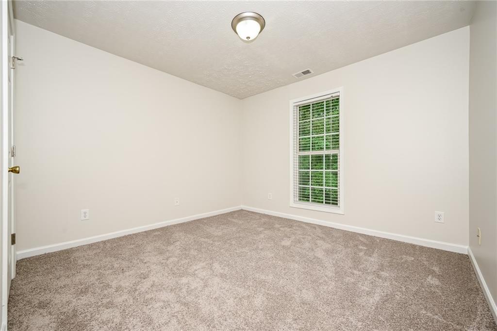 4468 Abram Way Conley, GA 30288 - Photo 11 of 23 an empty room with windows