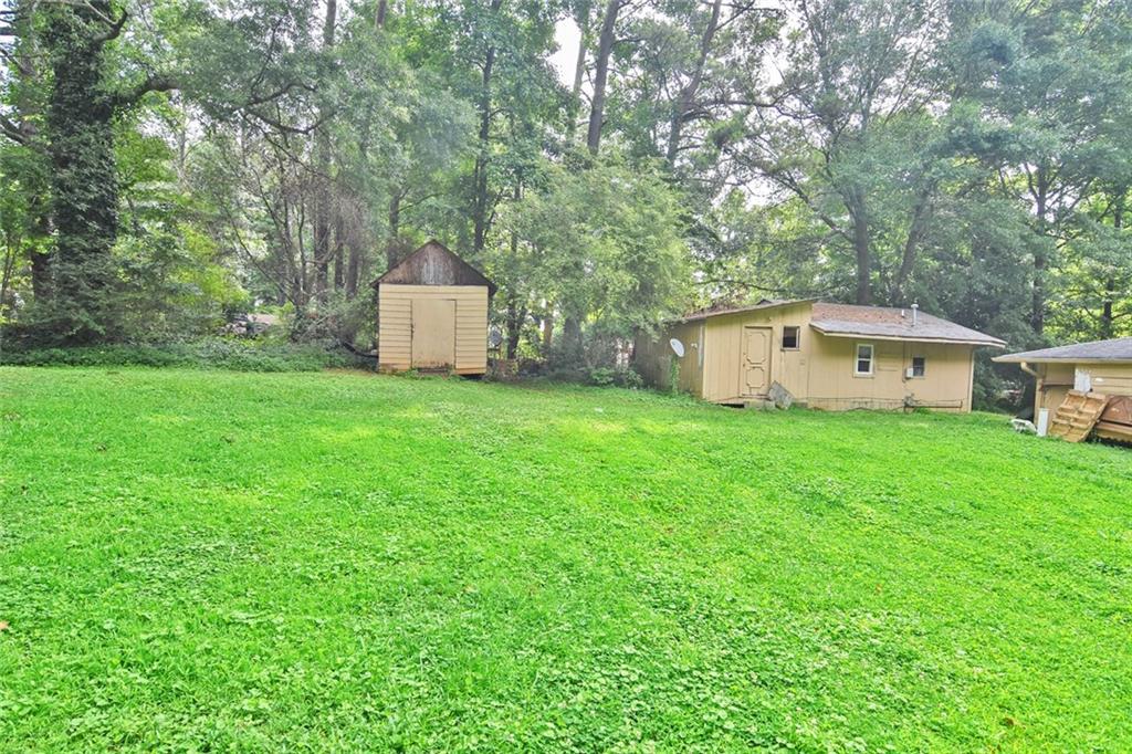 Second view of additional storage buildings and super level greenspace between two duplexes