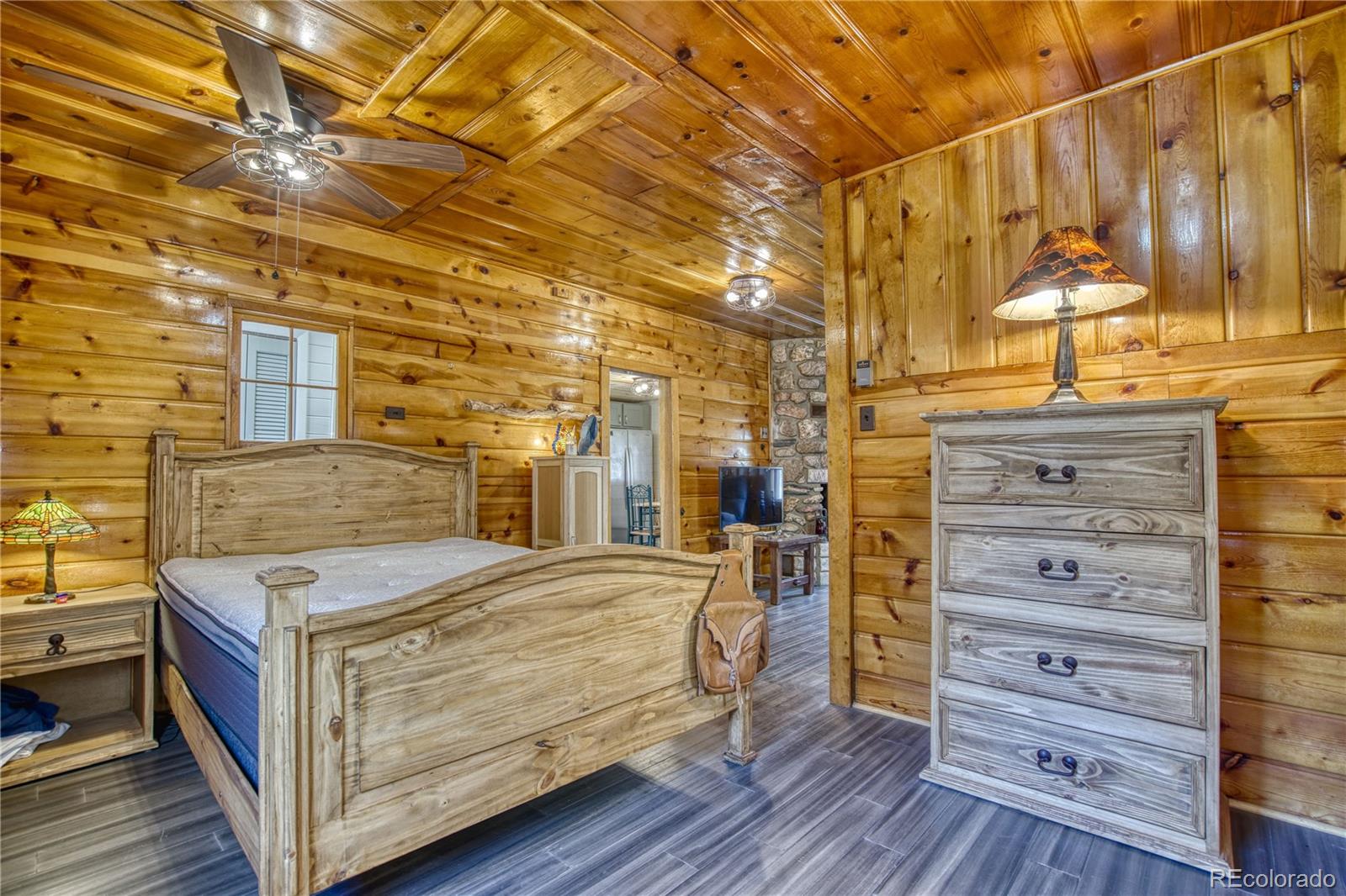 236 Rustic Road Bellvue, CO 80512 - Photo 13 of 27 a bedroom with a bed and a dresser