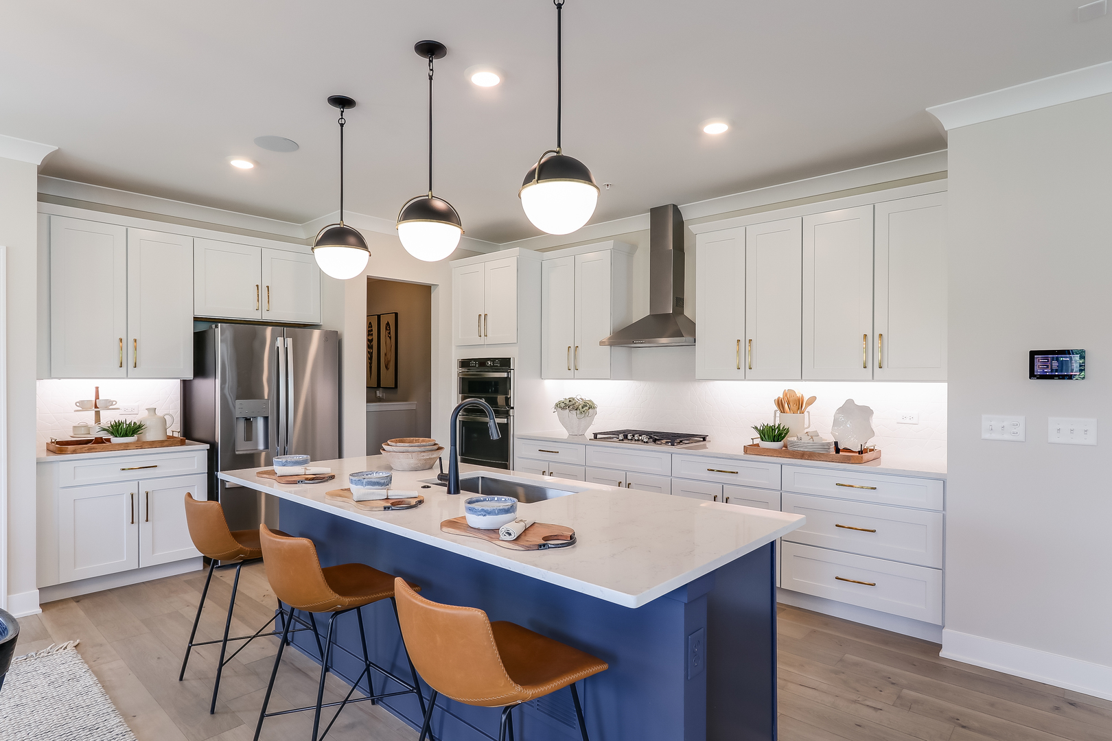 24 Hawthorn Rdg Drive Hawthorn Woods, IL 60047 - Photo 13 of 31 a kitchen with a center island wooden floor cabinets and stainless steel appliances