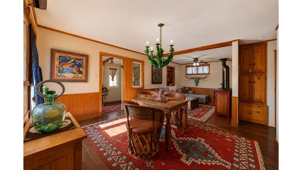 117 Reading Avenue North Center Point, TX 78010 - Photo 11 of 20 Interior space featuring wood-finish flooring, wood wall paneling, and a wood-beamed ceiling