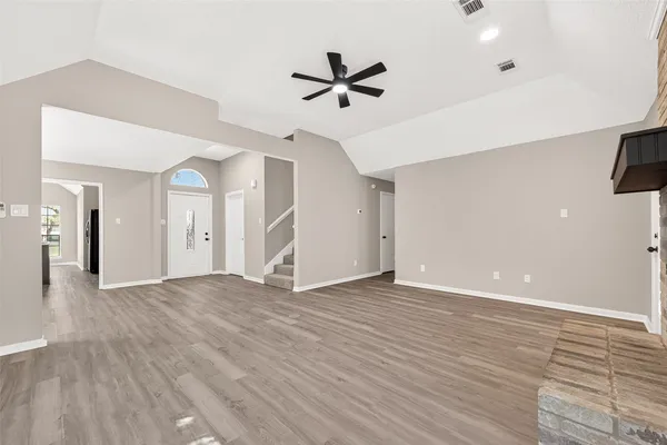 a view of an empty room with a window