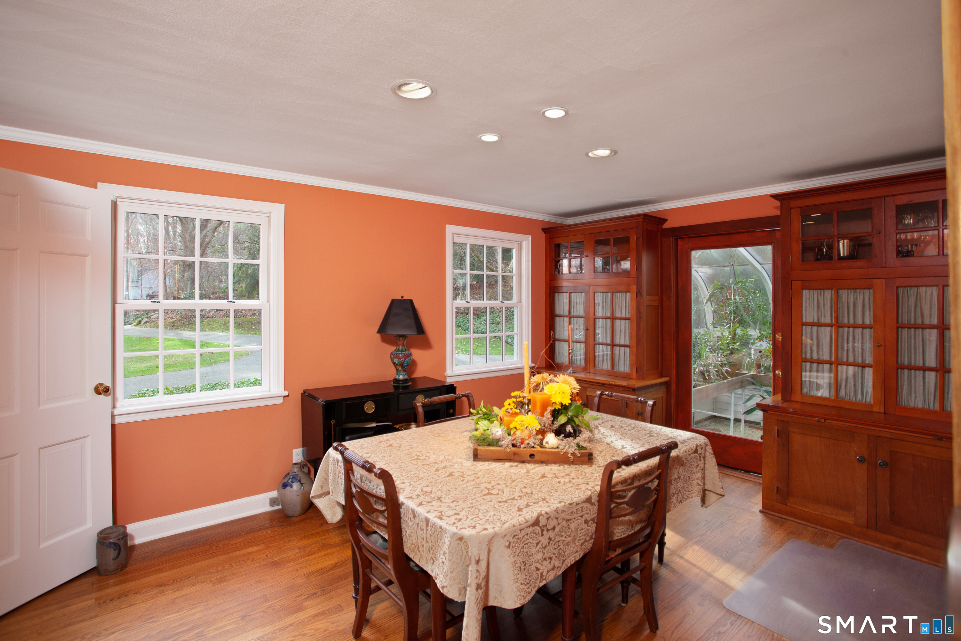 187 Wildcat Road Madison, CT 06443 - Photo 12 of 36 The Dining Room. Between in the builtins leads you into the Greenhouse.