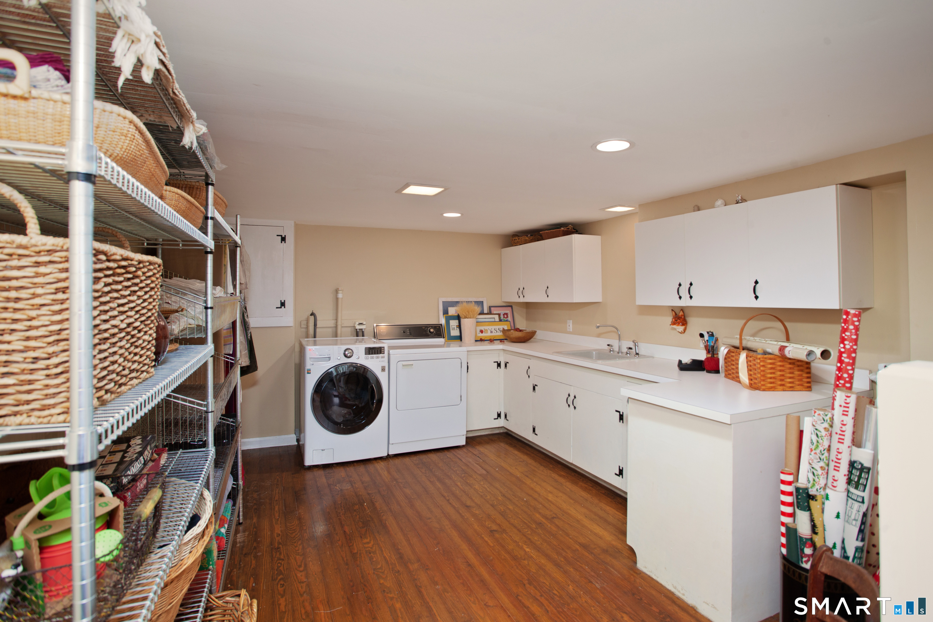 187 Wildcat Road Madison, CT 06443 - Photo 31 of 36 The extra large laundry area is located in the lower level.
