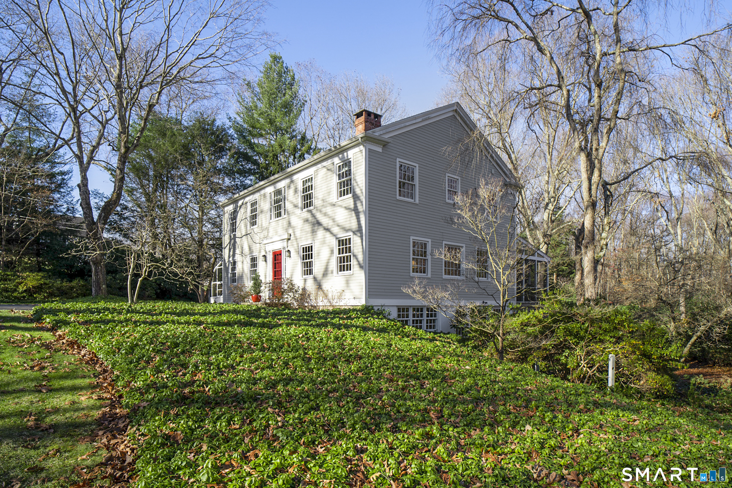 187 Wildcat Road Madison, CT 06443 - Photo 32 of 36 A side view of the home.