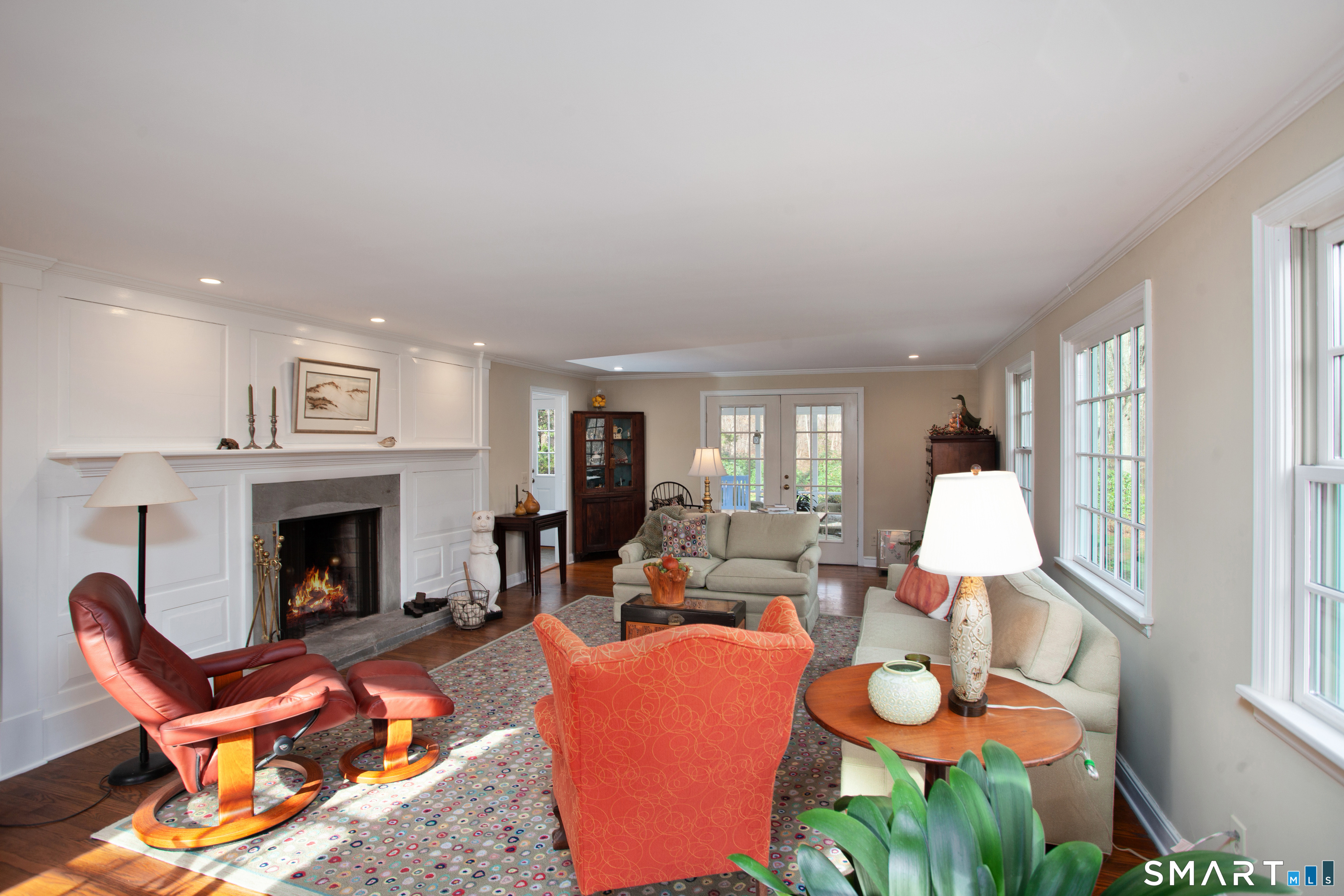 187 Wildcat Road Madison, CT 06443 - Photo 4 of 36 The door in the back leads to the screened in porch.