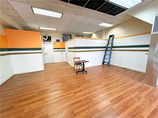 a bathroom with a sink toilet and a mirror