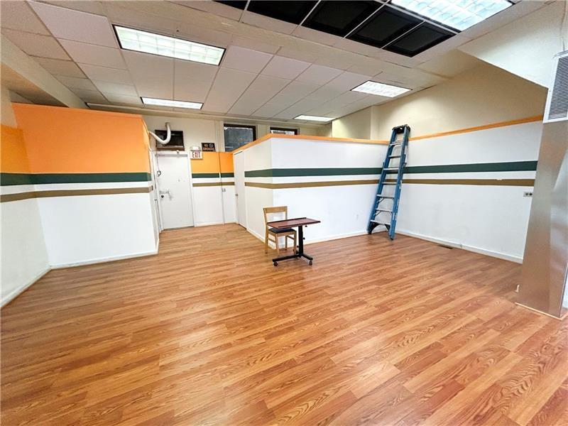 219 Brownsville Road Pittsburgh, PA 15210 - Photo 22 of 30 a view of a room with wooden floor