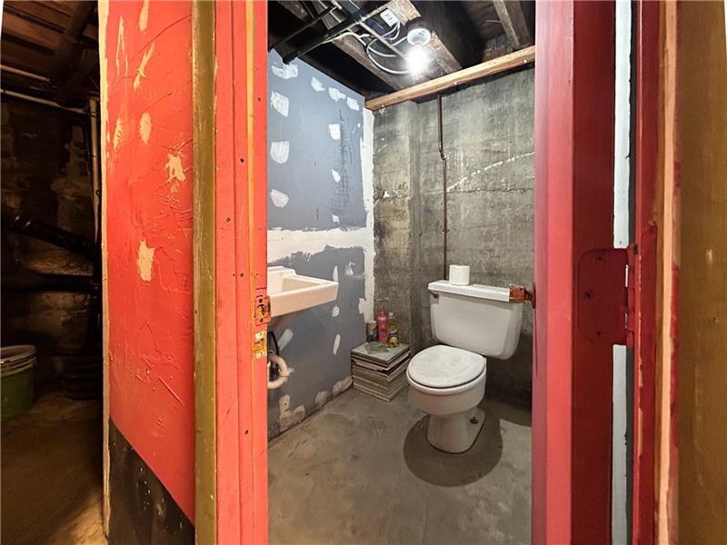 219 Brownsville Road Pittsburgh, PA 15210 - Photo 28 of 30 a bathroom with a toilet and a shower