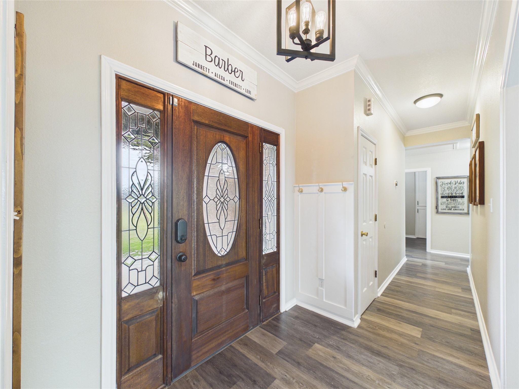 4610 Mustang Road Alvin, TX 77511 - Photo 9 of 50 View from entry looking down main hallway to bedrooms, laundry and bathrooms. Follow the beautiful floors and the crown molding.....