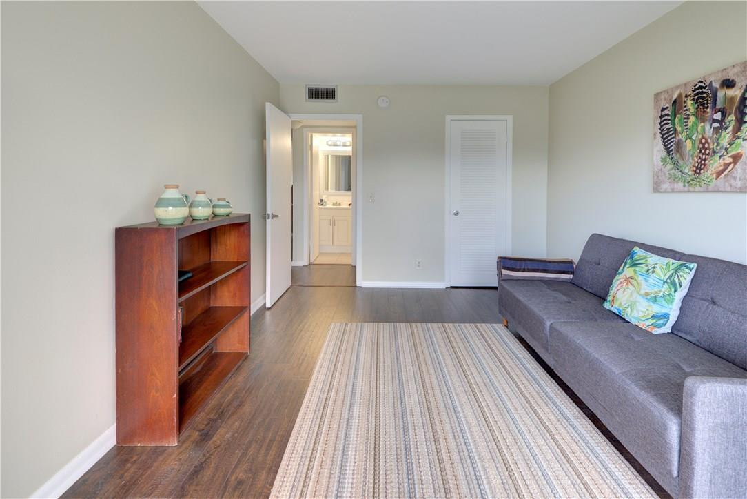 144 Dorset D, Unit 144 Boca Raton, FL 33434 - Photo 14 of 20 a living room with furniture and a couch