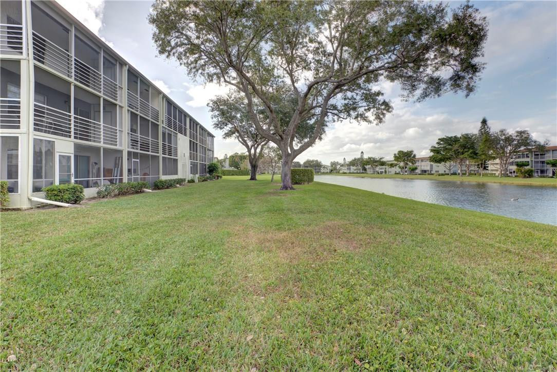 144 Dorset D, Unit 144 Boca Raton, FL 33434 - Photo 20 of 20 a view of building with outdoor space