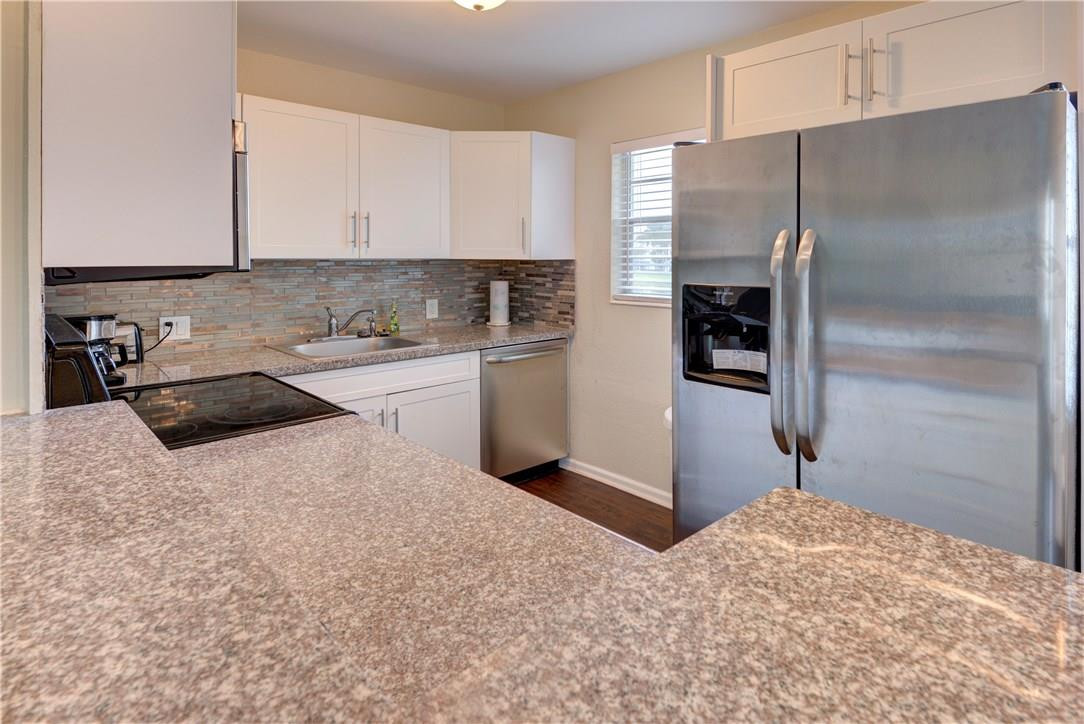 144 Dorset D, Unit 144 Boca Raton, FL 33434 - Photo 3 of 20 a kitchen with a refrigerator and a sink