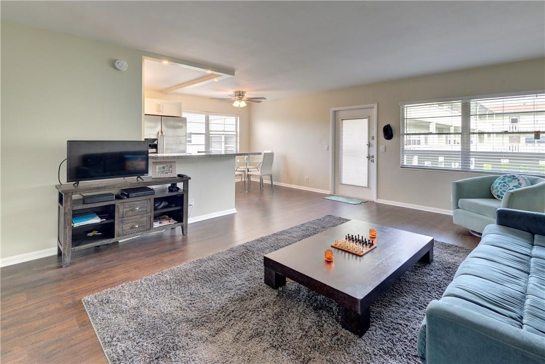 144 Dorset D, Unit 144 Boca Raton, FL 33434 - Photo 9 of 20 a living room with furniture a rug and a large window