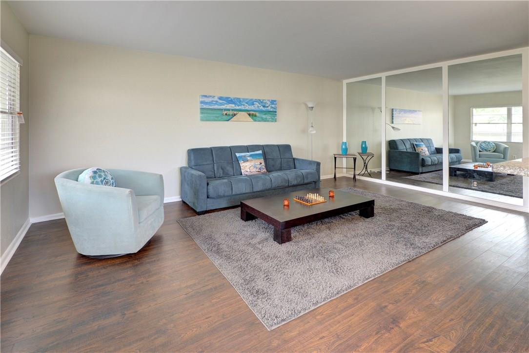144 Dorset D, Unit 144 Boca Raton, FL 33434 - Photo 10 of 20 a living room with furniture and a table