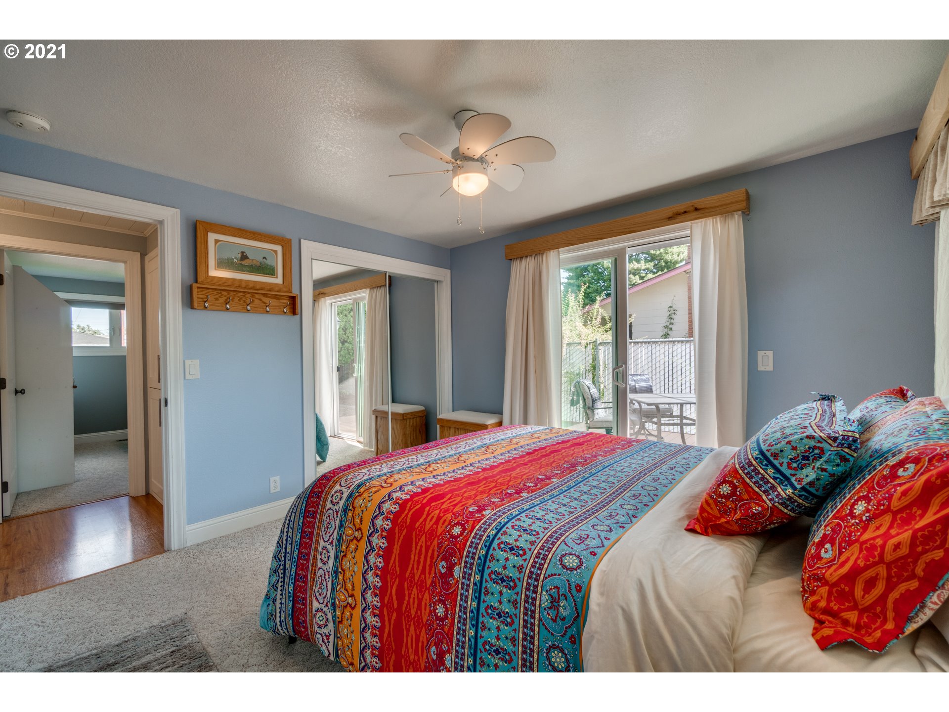 3132 1st Street Hubbard, OR 97032 - Photo 18 of 32 a bedroom with a large bed and a large window