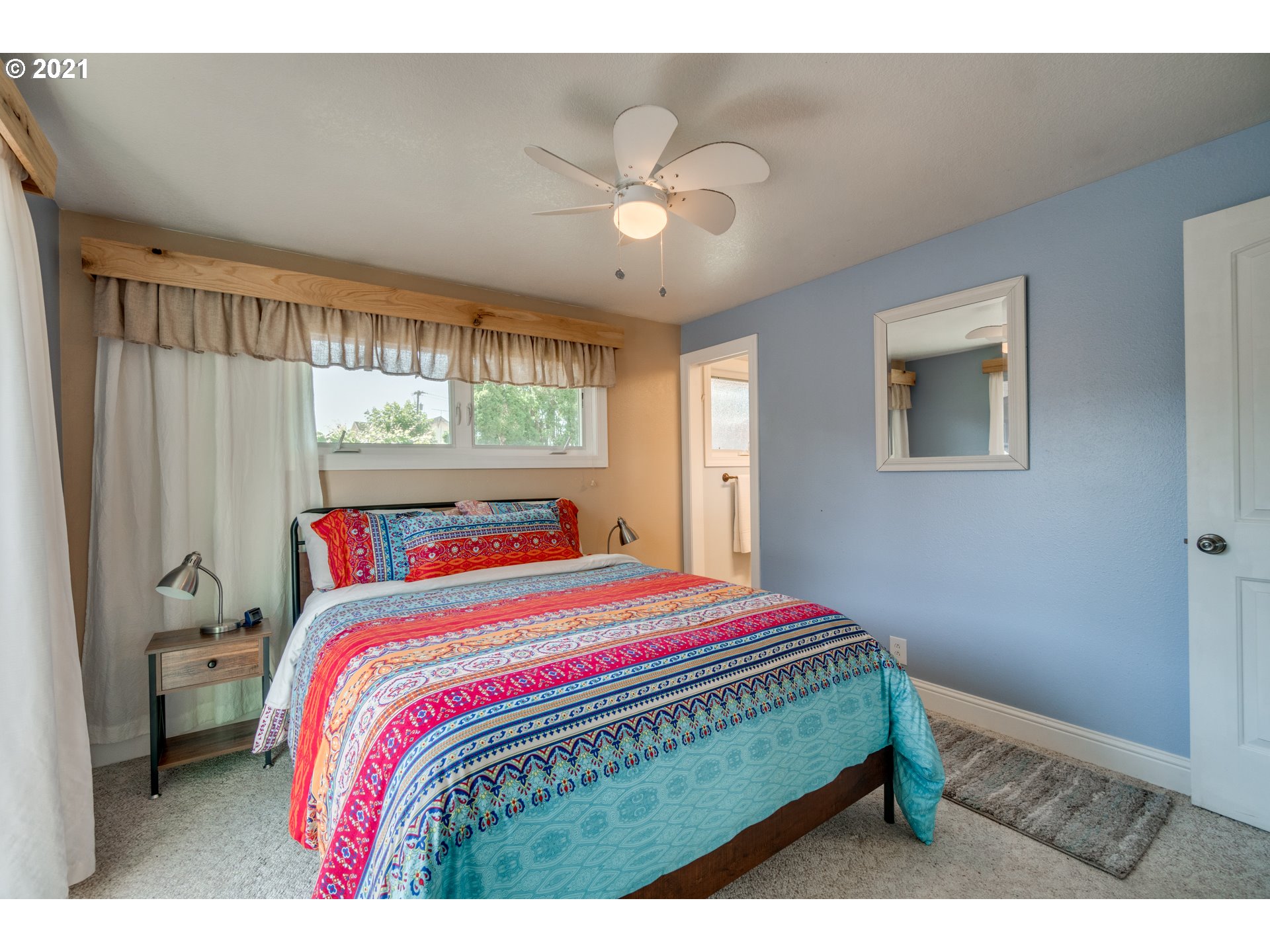 3132 1st Street Hubbard, OR 97032 - Photo 19 of 32 a bedroom with a bed and a window