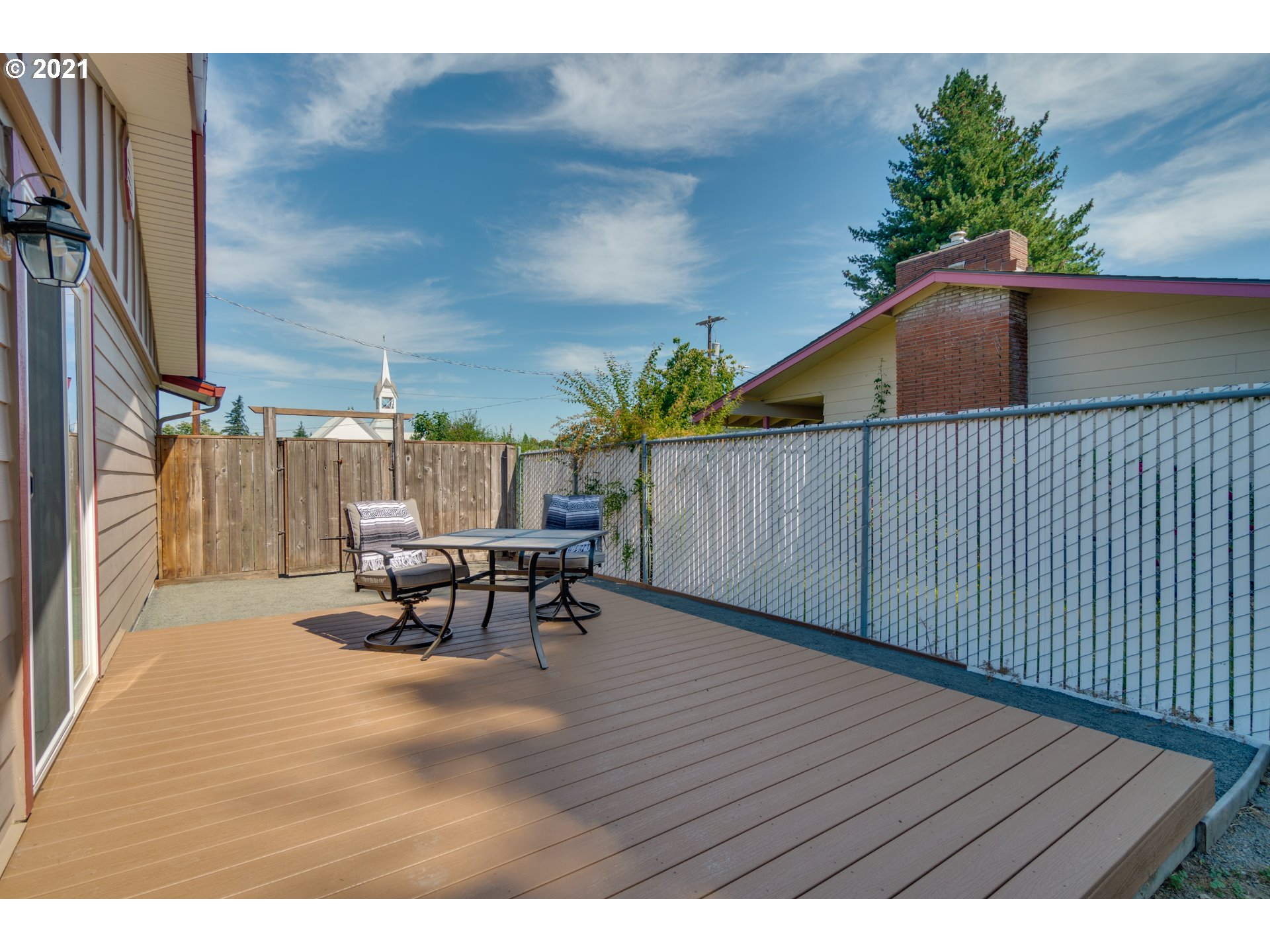 3132 1st Street Hubbard, OR 97032 - Photo 20 of 32 a view of a patio with a table and chairs