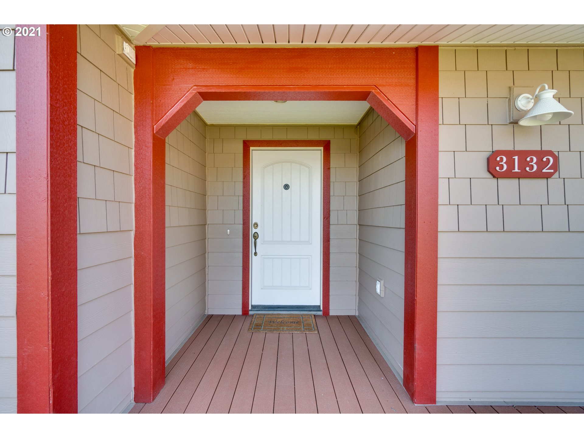 3132 1st Street Hubbard, OR 97032 - Photo 4 of 32 a view of a wooden door and a floor to ceiling window