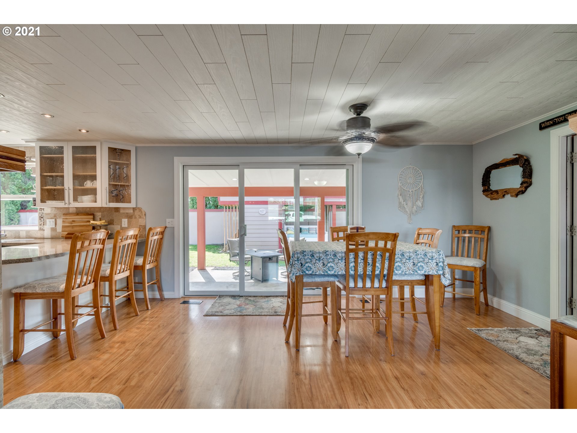 3132 1st Street Hubbard, OR 97032 - Photo 10 of 32 a view of a dining room with furniture window and wooden floor