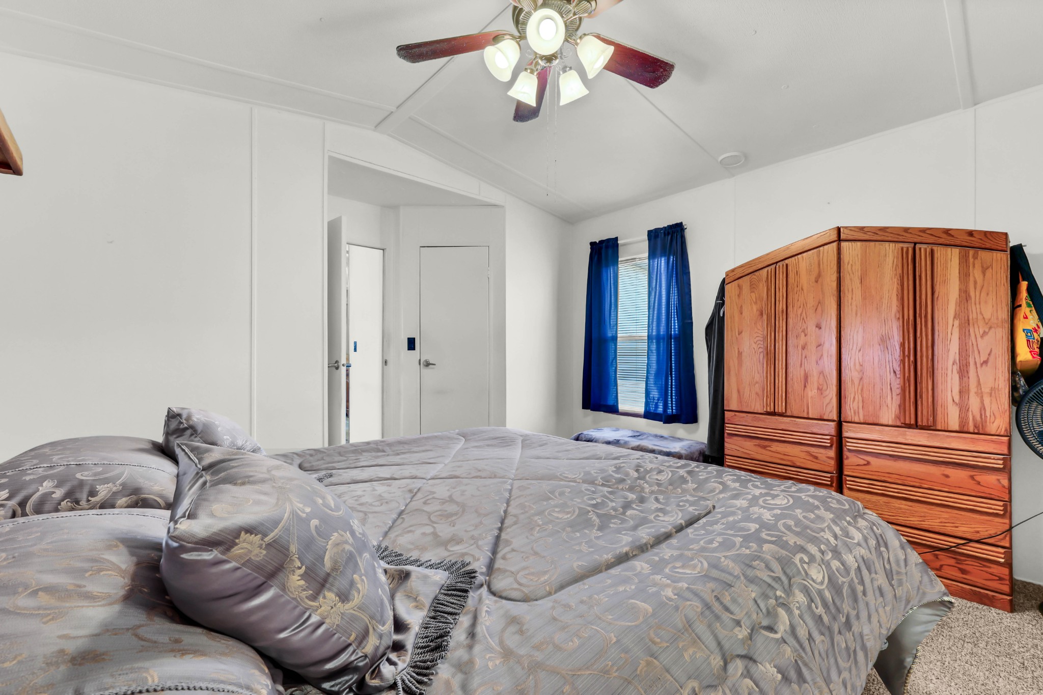 1765 Woolworth Road Erin, TN 37061 - Photo 13 of 34 a bedroom with a large bed and a chandelier