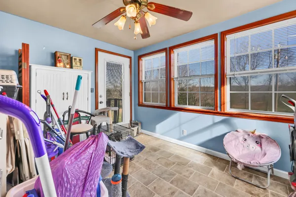 a living room with furniture and a large window