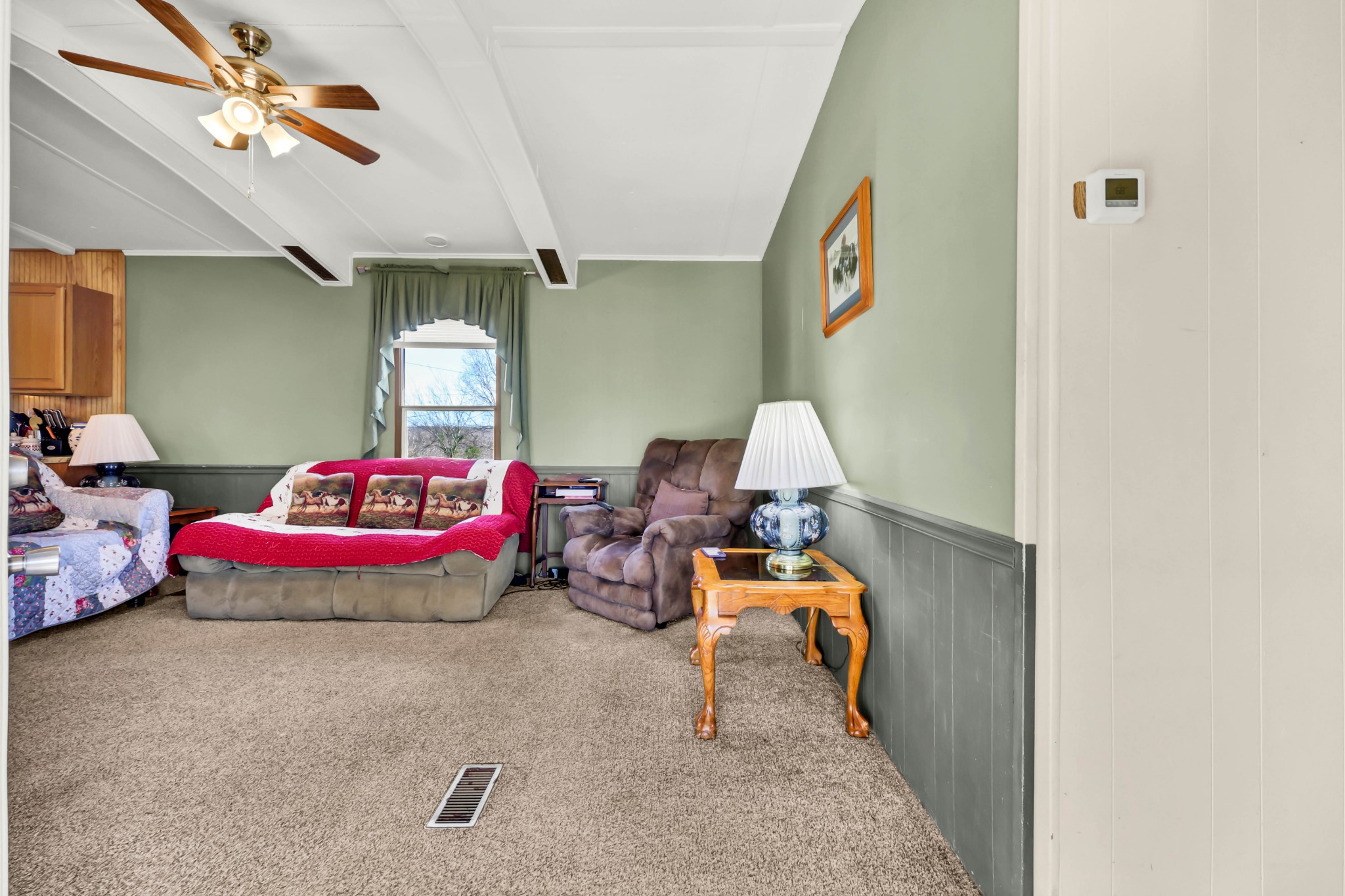 1765 Woolworth Road Erin, TN 37061 - Photo 2 of 34 a bedroom with furniture and a chandelier