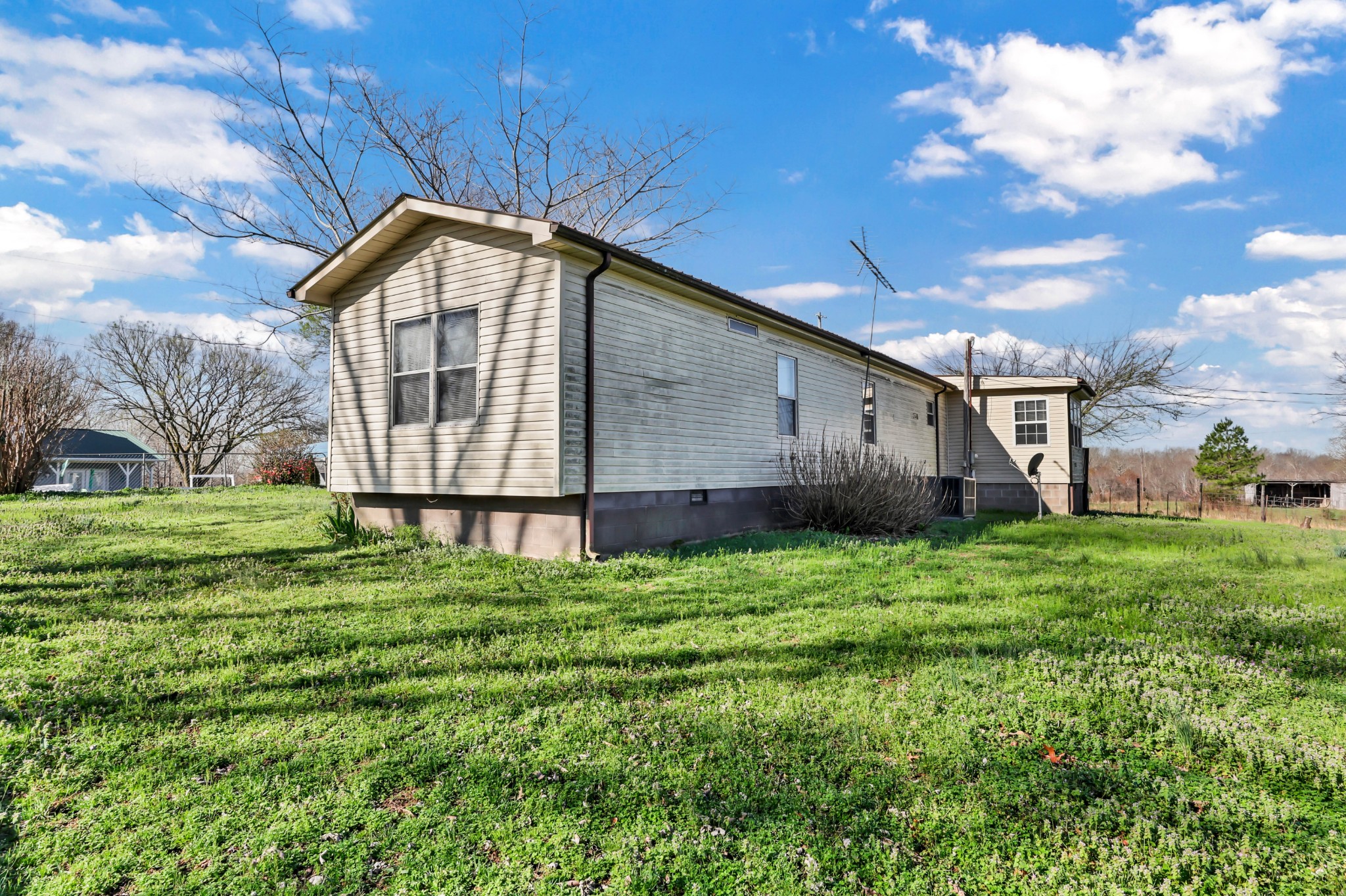 1765 Woolworth Road Erin, TN 37061 - Photo 23 of 34 a backyard of a house with lots of green space