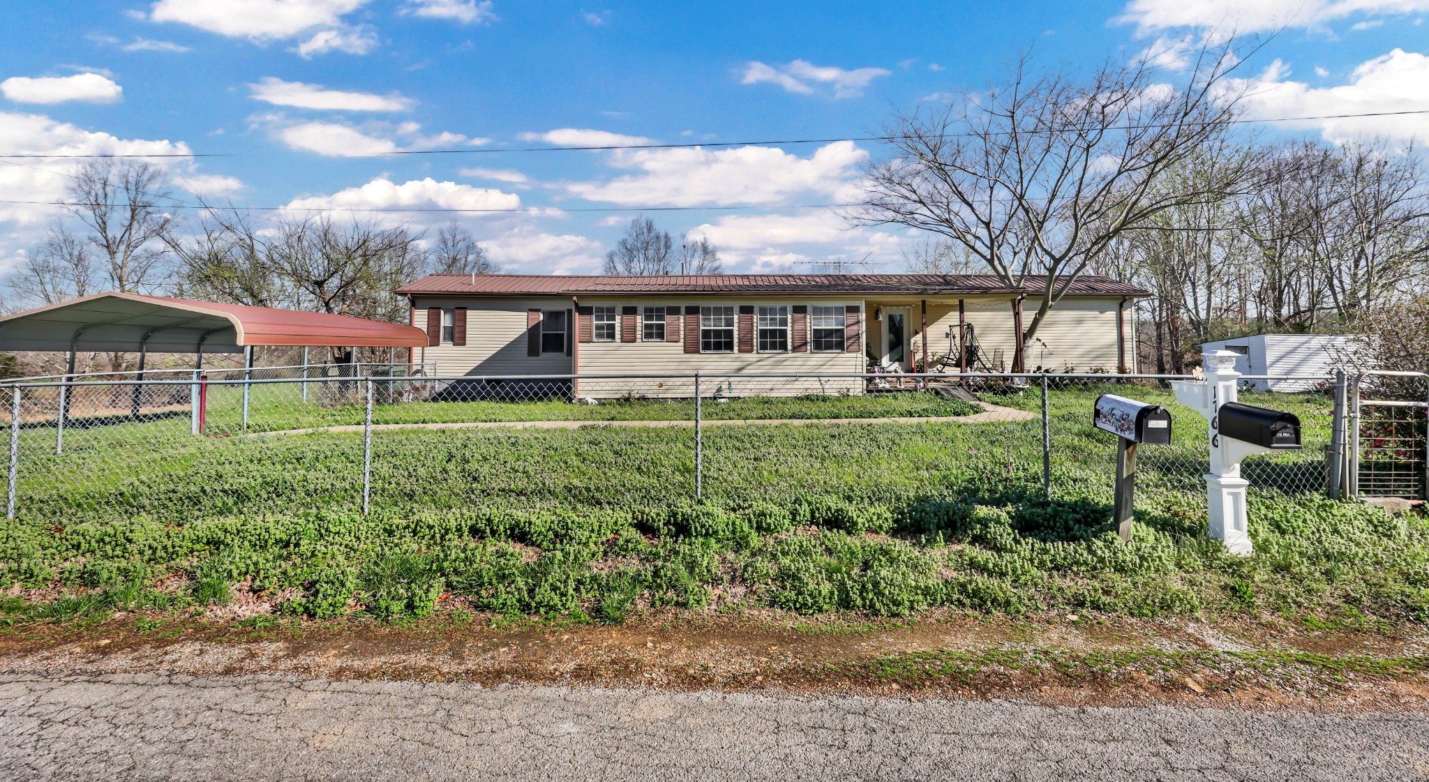 1765 Woolworth Road Erin, TN 37061 - Photo 29 of 34 a house view with a garden space