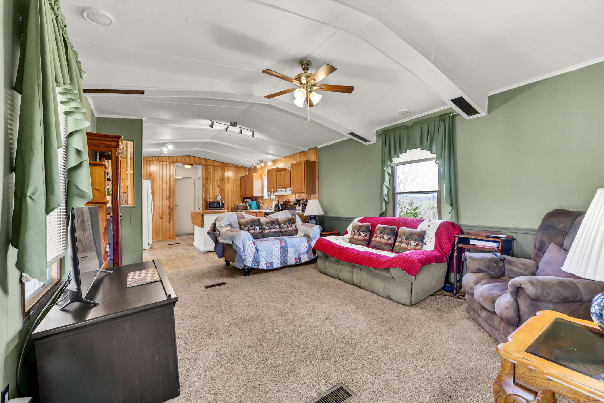 1765 Woolworth Road Erin, TN 37061 - Photo 3 of 34 a living room with furniture and a flat screen tv