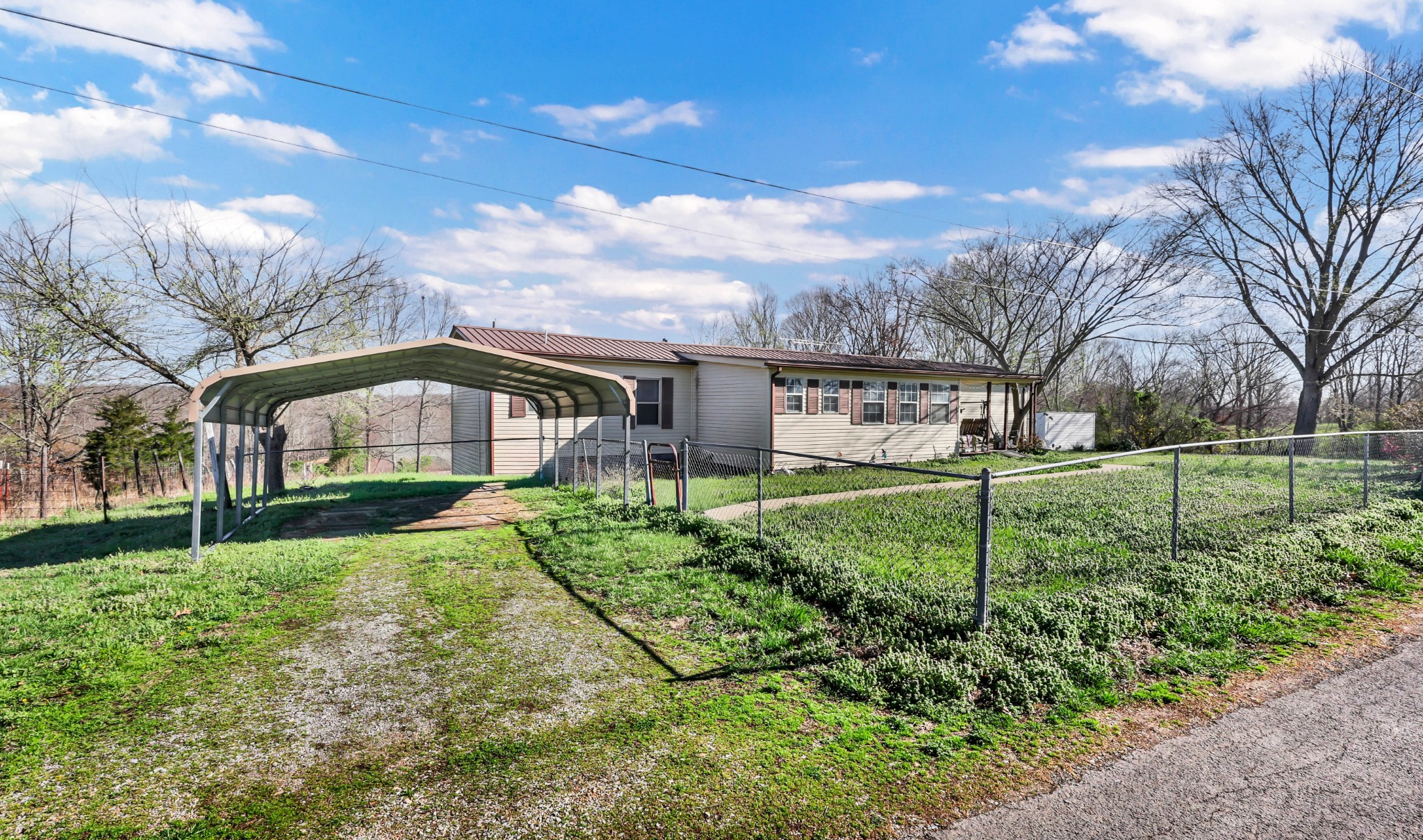 1765 Woolworth Road Erin, TN 37061 - Photo 31 of 34 a front view of a house with garden