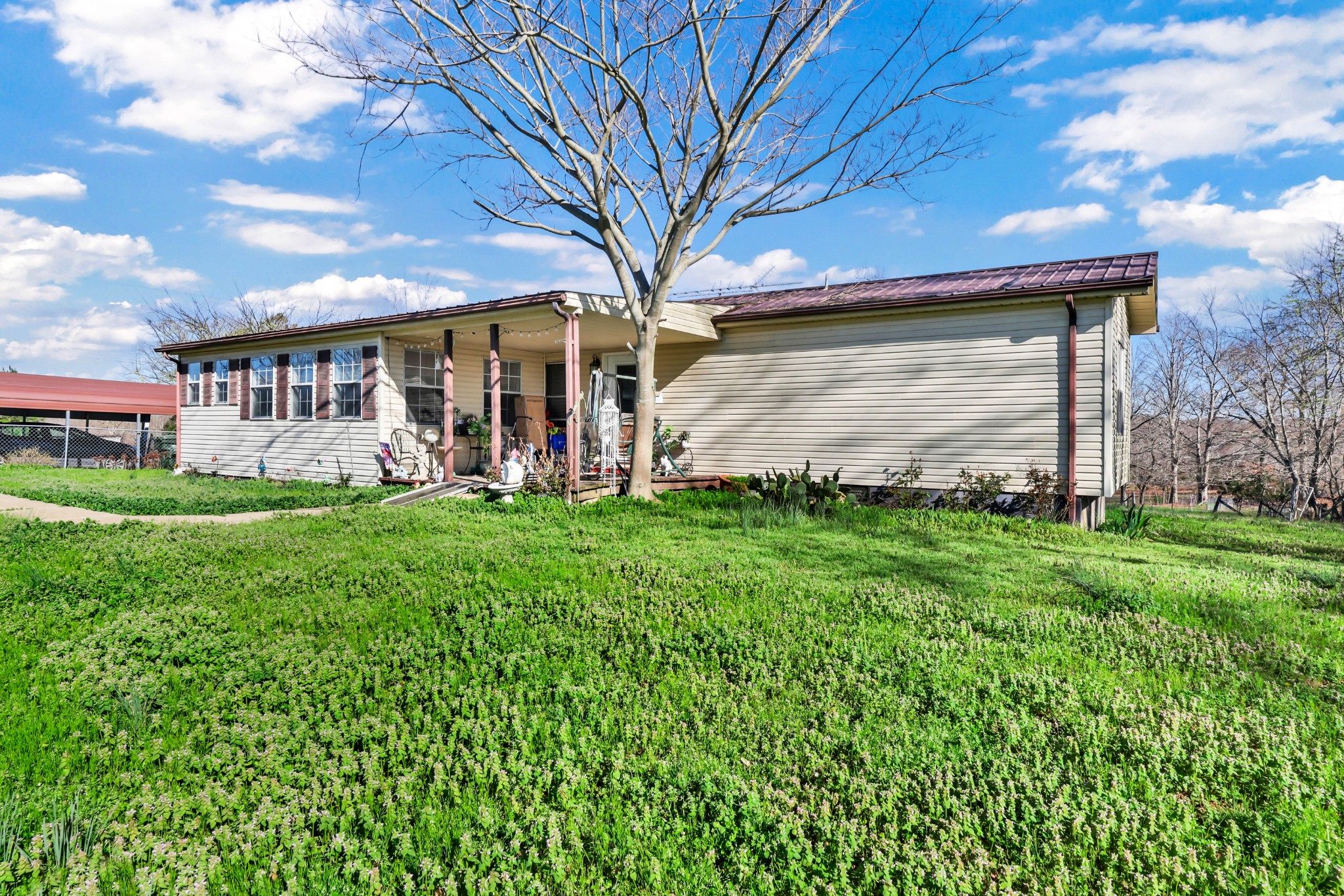1765 Woolworth Road Erin, TN 37061 - Photo 32 of 34 a view of a house with big yard and large trees