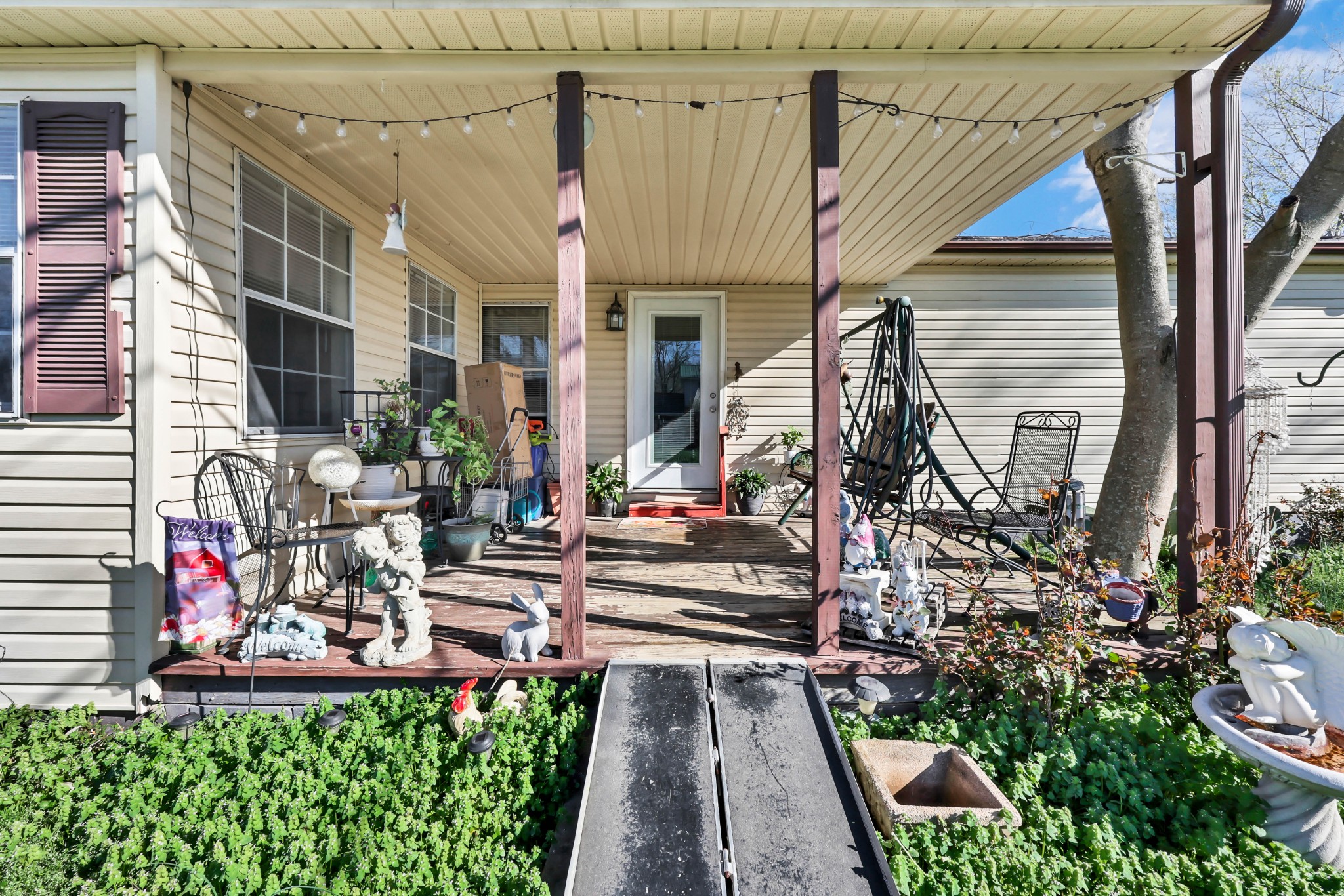 1765 Woolworth Road Erin, TN 37061 - Photo 34 of 34 a view of house with a yard and potted plants