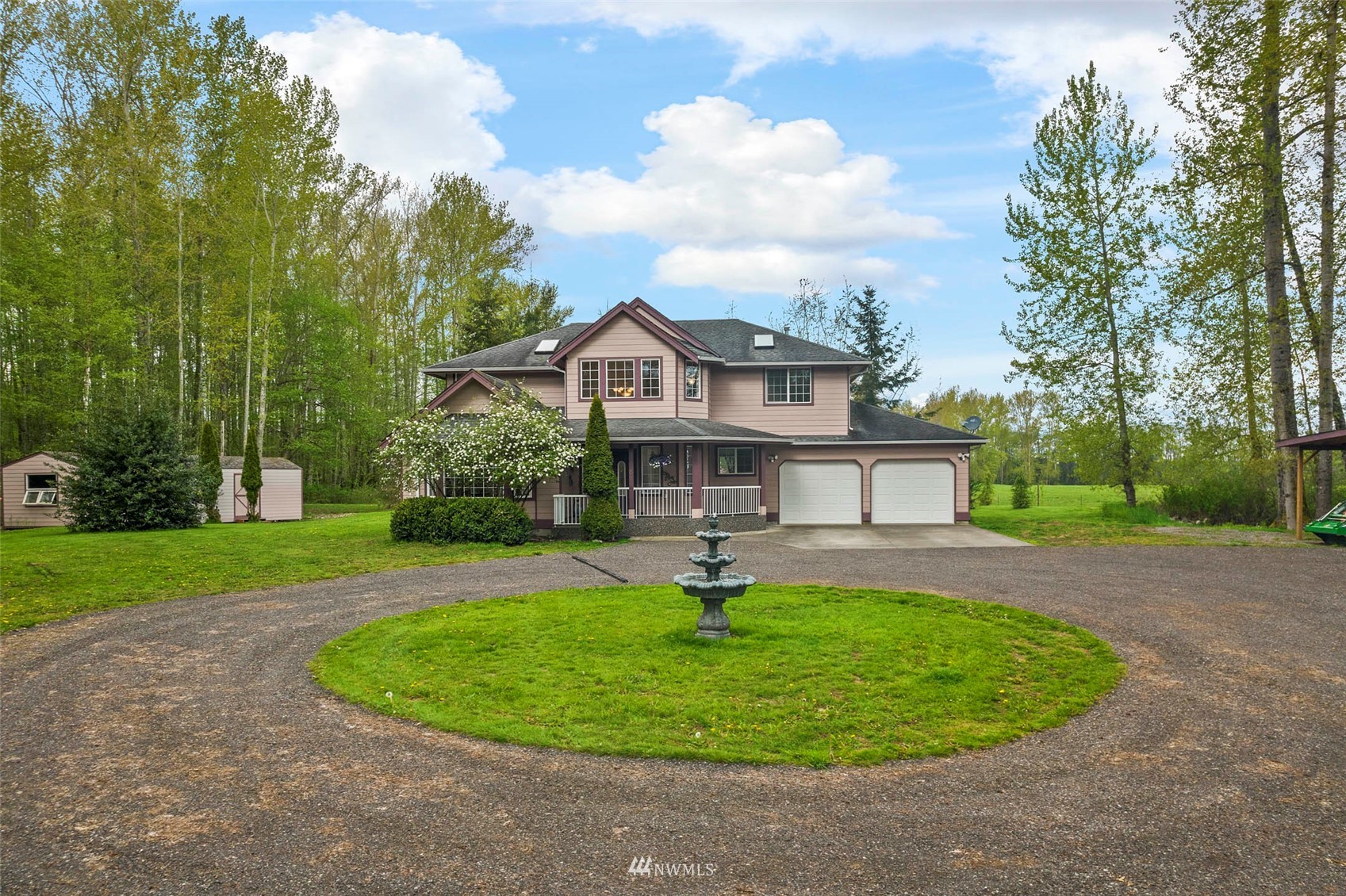 7511 Ham Road Ferndale, WA 98248 - Photo 1 of 40 a front view of a house with a yard and trees