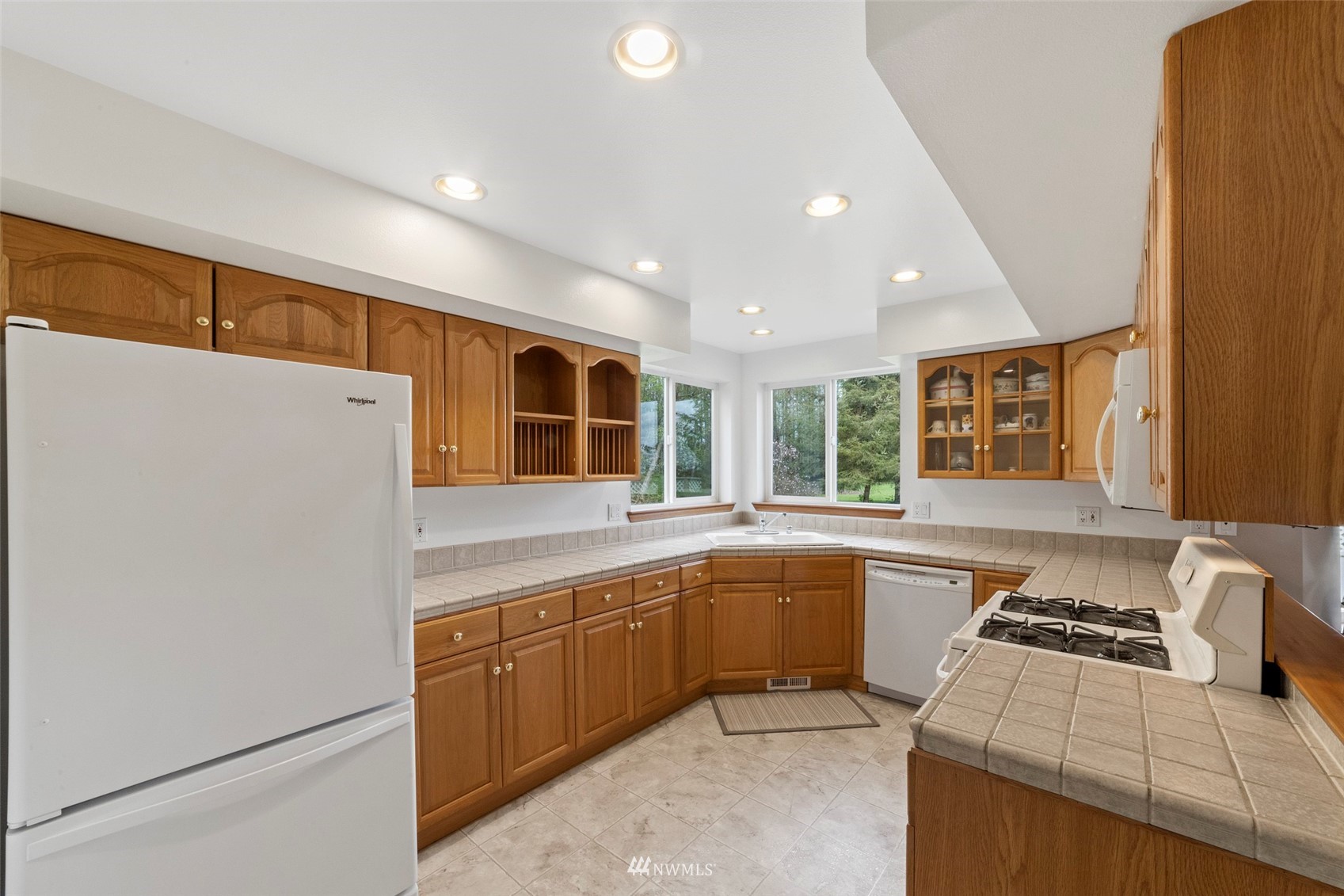 7511 Ham Road Ferndale, WA 98248 - Photo 11 of 40 a kitchen that has a sink and a stove in it