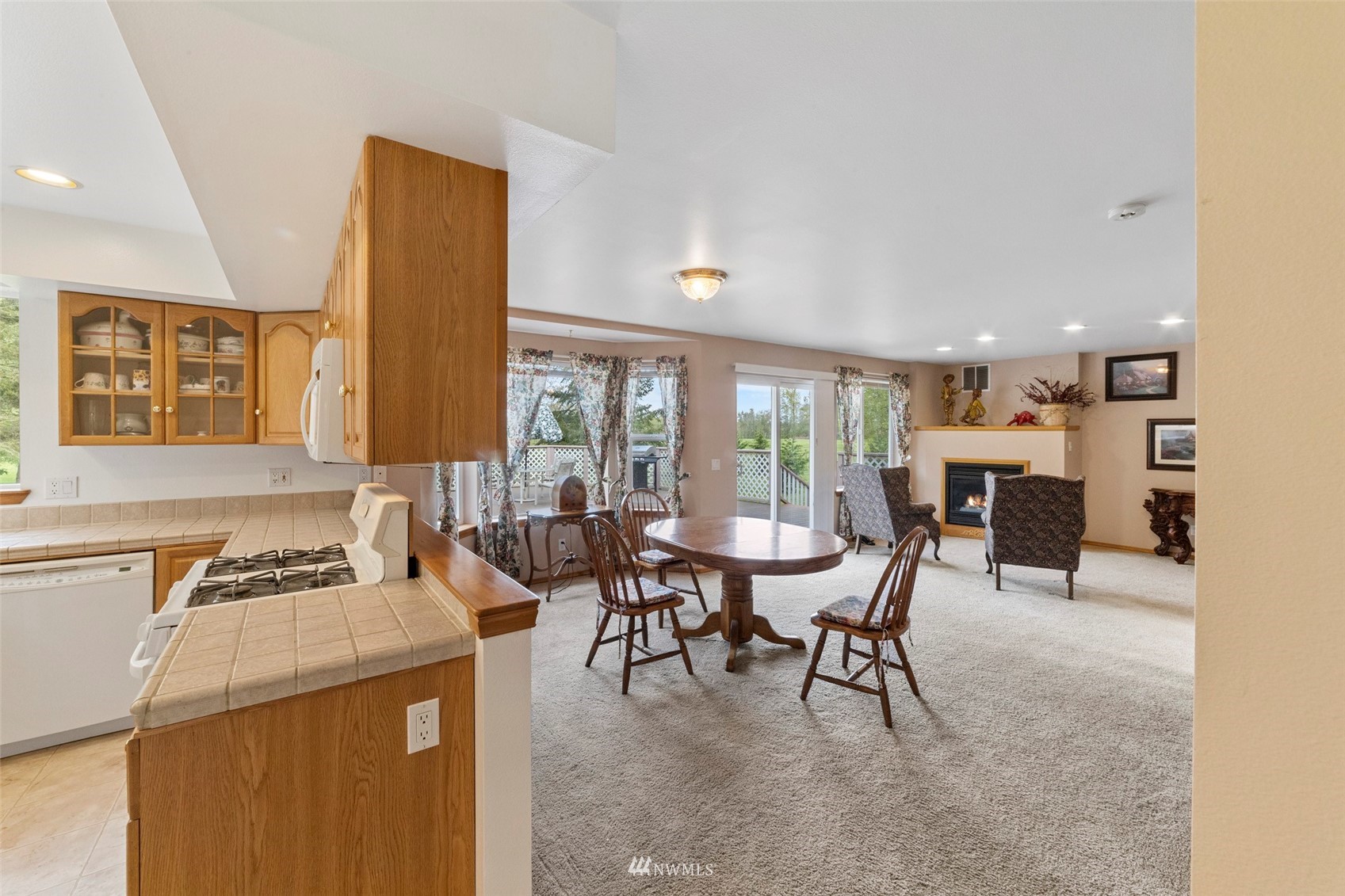 7511 Ham Road Ferndale, WA 98248 - Photo 12 of 40 a dining room with furniture and a large window