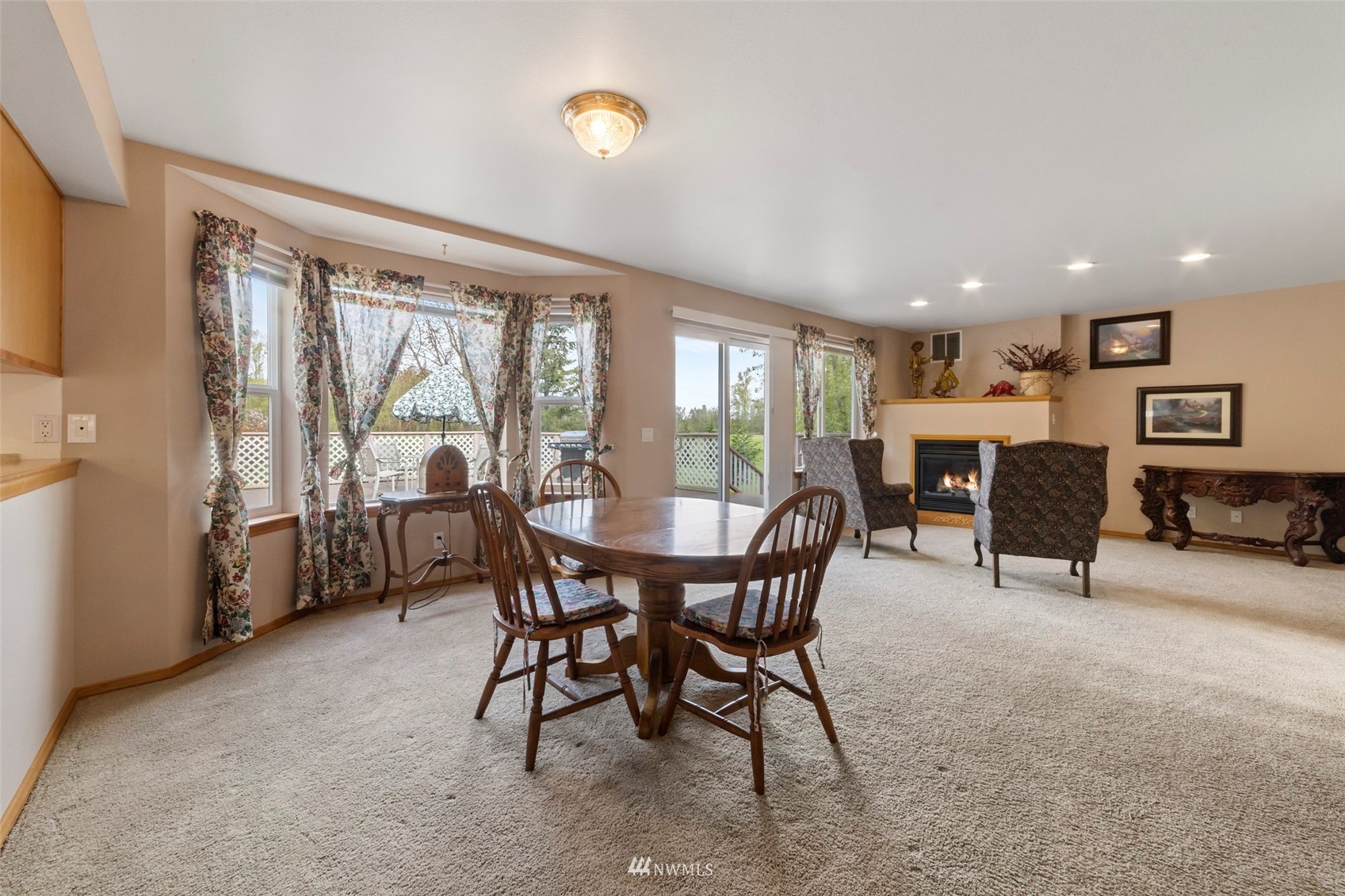 7511 Ham Road Ferndale, WA 98248 - Photo 14 of 40 a view of a dining room and livingroom with furniture window and outside view