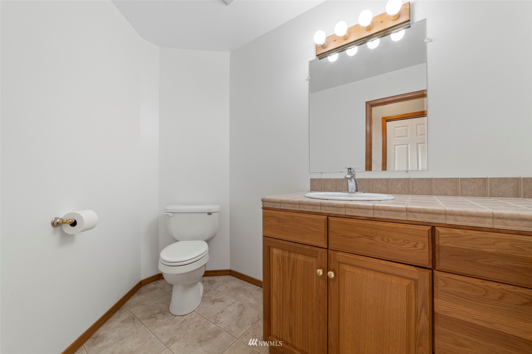 7511 Ham Road Ferndale, WA 98248 - Photo 16 of 40 a bathroom with a sink a toilet and mirror