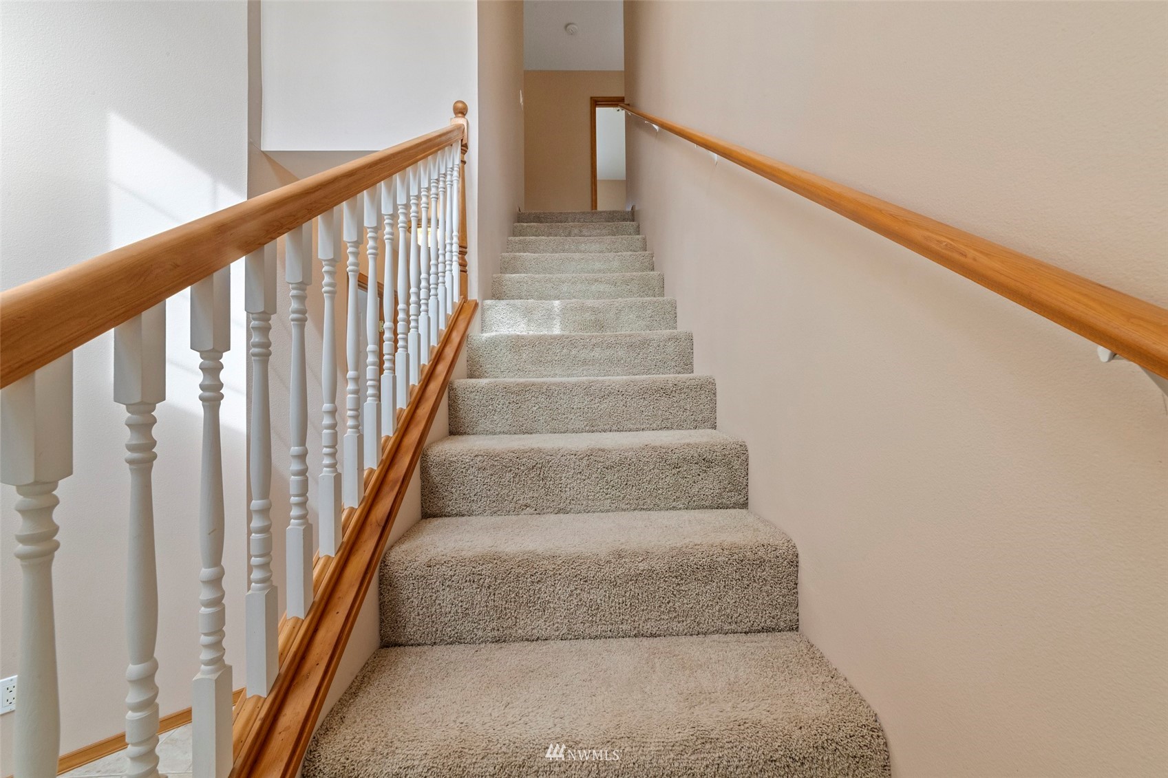 7511 Ham Road Ferndale, WA 98248 - Photo 17 of 40 a view of staircase with lots of frames on wall and stairs