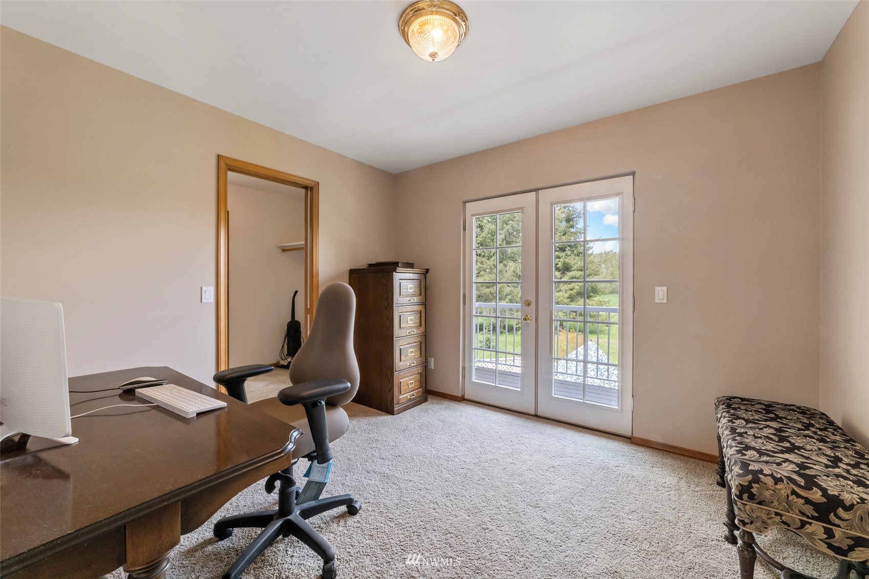 7511 Ham Road Ferndale, WA 98248 - Photo 23 of 40 a view of a workspace with furniture and a window