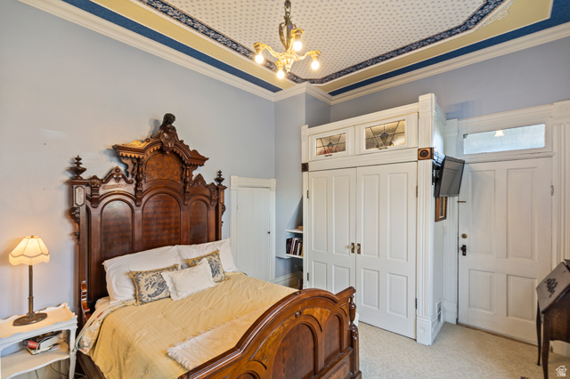 390 North 100 West Monroe, UT 84754 - Photo 93 of 167 Bedroom with crown molding, a closet, carpet, and a chandelier