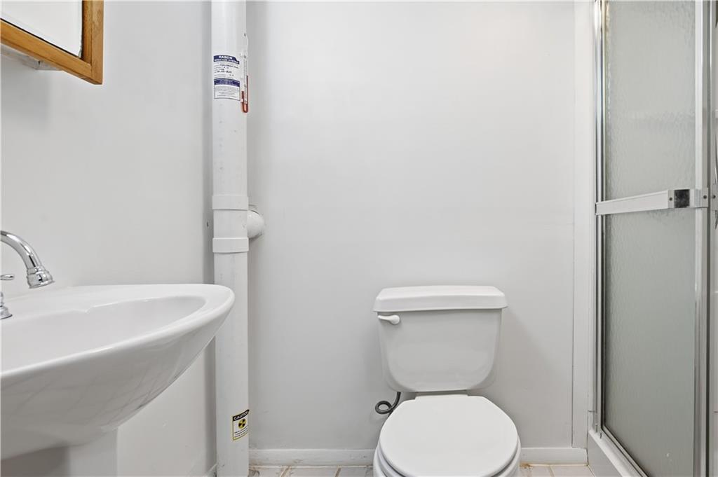 1425 Swede Hill Road Greensburg, PA 15601 - Photo 28 of 42 a bathroom with a toilet a sink and mirror