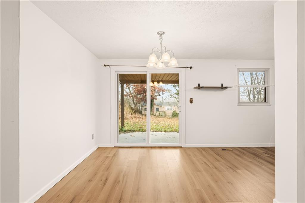 1425 Swede Hill Road Greensburg, PA 15601 - Photo 9 of 42 wooden floor in an empty room with a window