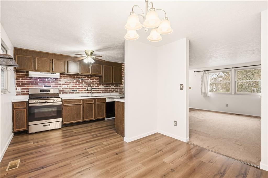 1425 Swede Hill Road Greensburg, PA 15601 - Photo 10 of 42 a kitchen with stainless steel appliances a stove top oven and cabinets